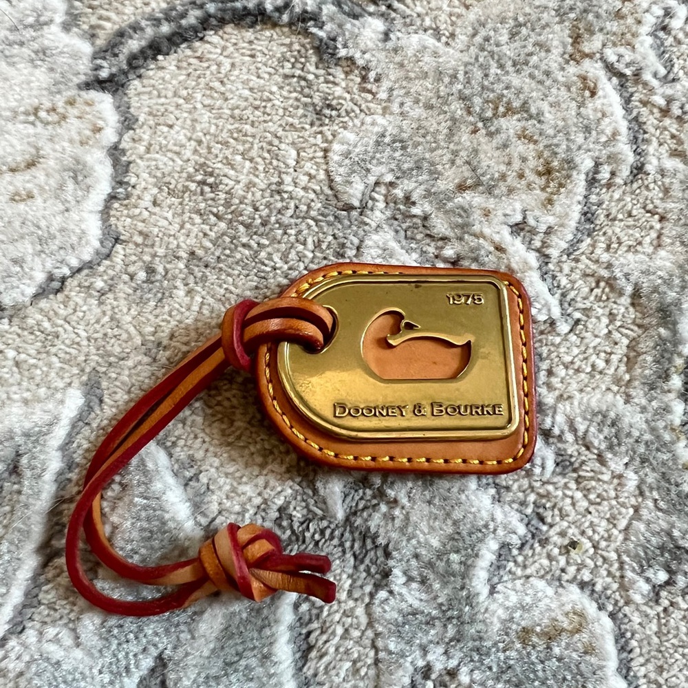Vintage Dooney & Bourke 1975 Brass and Leather Duck Hang Tag.